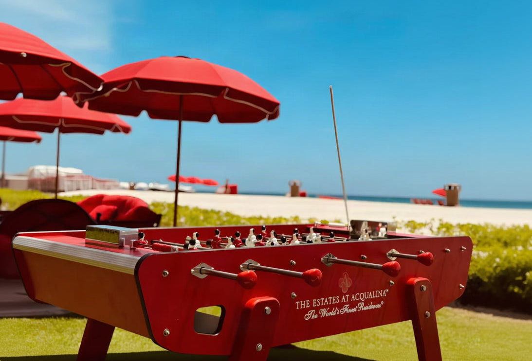 Red foosball table overlooking the beach at The Estates at Acqualina