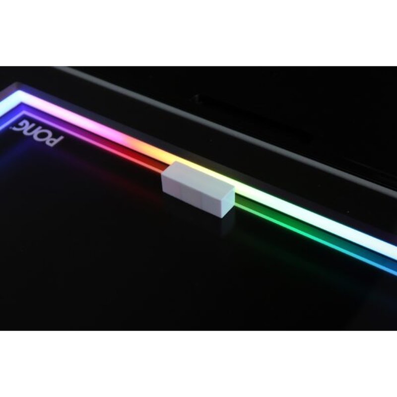 Atari PONG Mechanical Table Home Edition, close-up of paddle on RGB-lit playfield track, PONG logo visible.