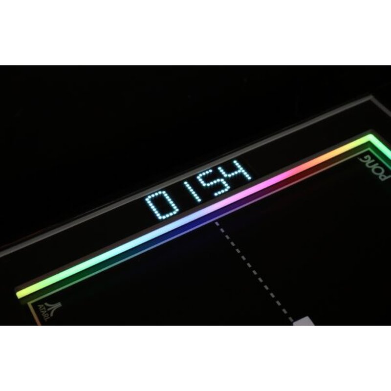 Atari PONG Mechanical Table Home Edition, close-up of LED score display and RGB-lit playfield edge.