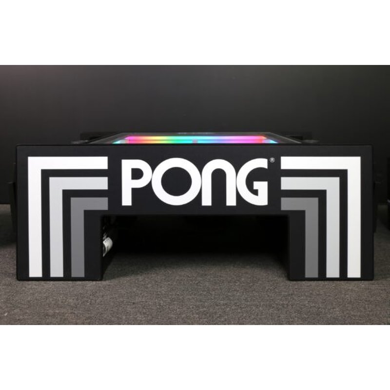 Atari PONG Mechanical Table Home Edition, front view with PONG logo, geometric corners, RGB playfield glow above.