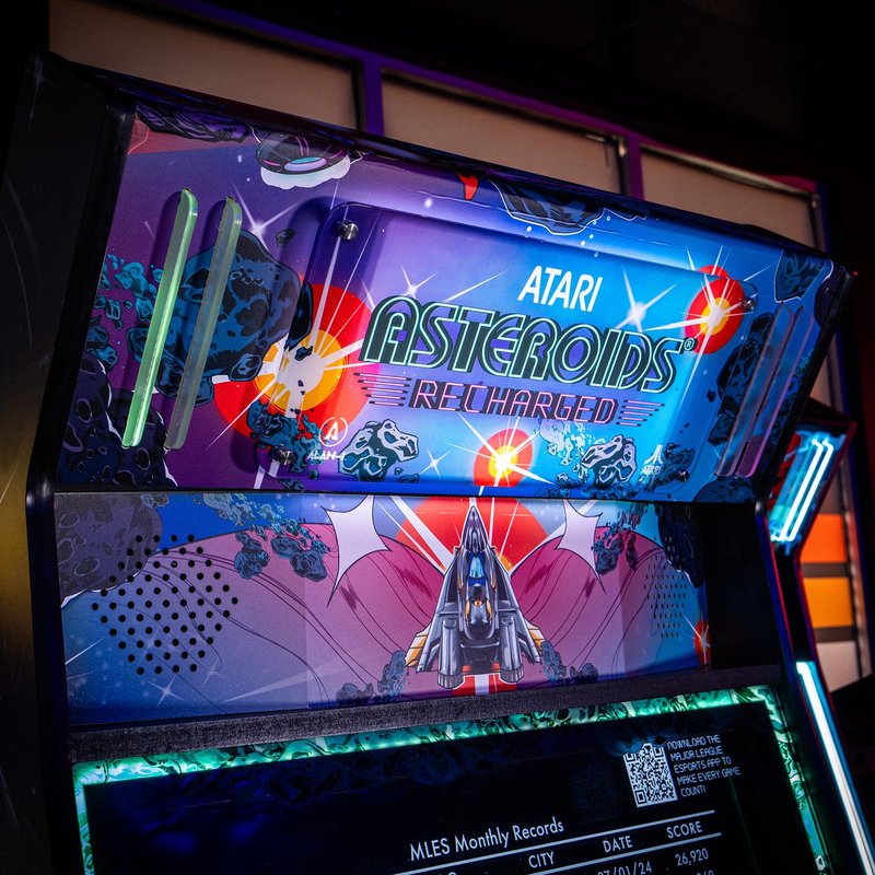 Atari Asteroids Recharged Pro arcade cabinet by Alan-1 front three quarter view with illuminated marquee, 32 inch monitor, and two player control panel.