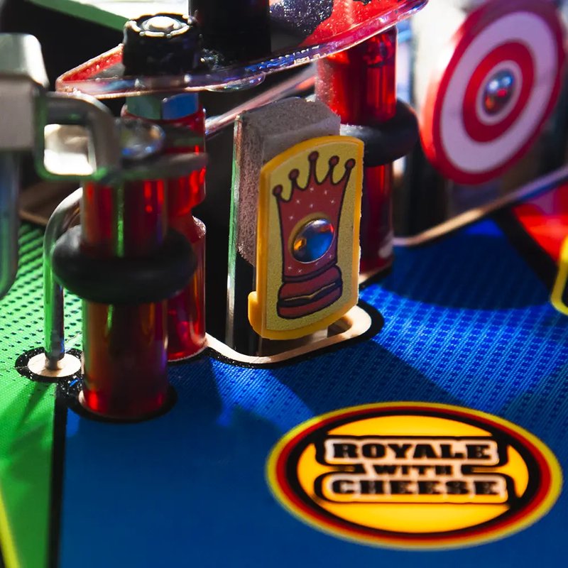 Chicago Gaming Pulp Fiction commercial pinball machine playfield showing red target buttons and arrow inserts during gameplay image