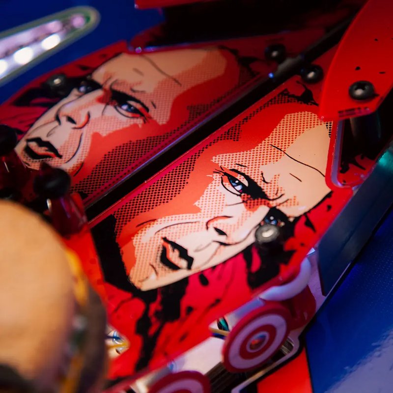 Chicago Gaming Pulp Fiction pinball machine playfield detail showing character artwork and pop bumpers on commercial coin-operated game image