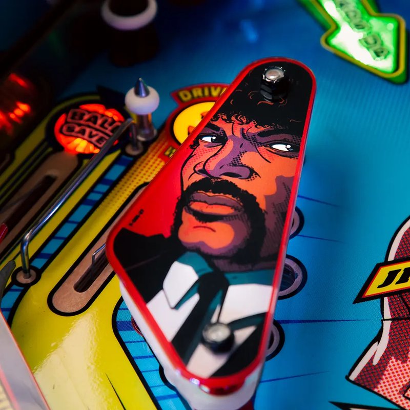Chicago Gaming Pulp Fiction pinball machine playfield detail showing character artwork and game elements on commercial coin-operated machine image