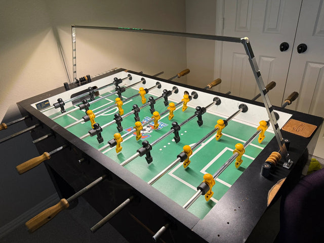 Foosball table light above a Tornado table shared by Adam Everett