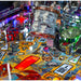 Stern Metallica Remastered Premium pinball machine playfield detail showing Sparky's Electric Chair sculpture, Grave Marker, and Snake feature with colorful artwork and illuminated elements.