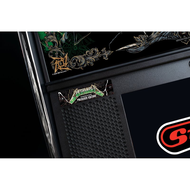 Stern Metallica Remastered Premium Edition pinball machine speaker panel with Metallica logo badge and hexagonal speaker grille detail.