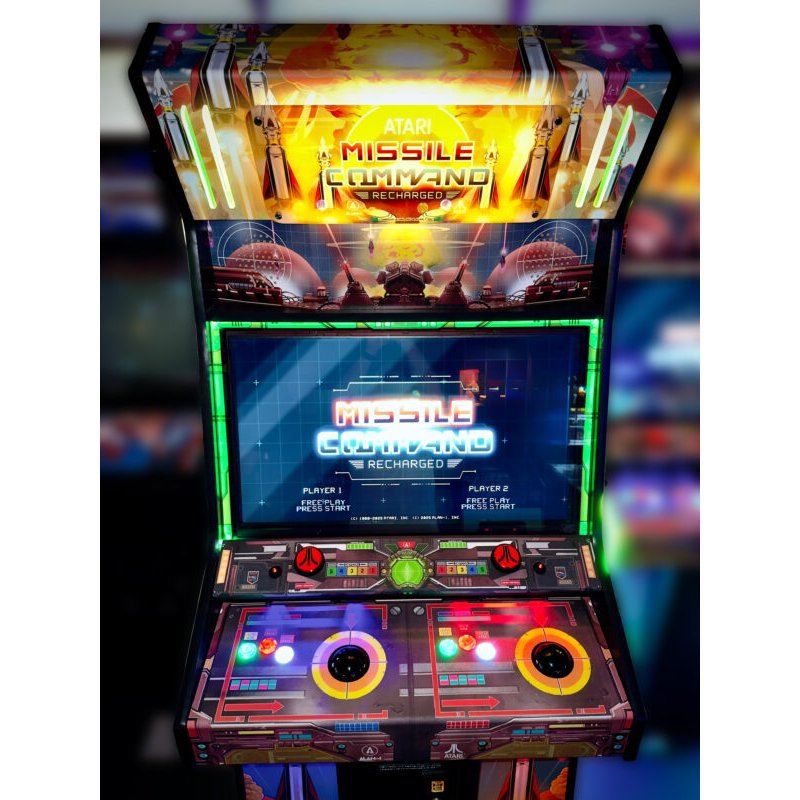 Atari Missile Command Recharged Pro arcade cabinet front view showing illuminated marquee, display screen, and dual control panels with trackballs and buttons.