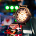 Ritchie vintage watch with bronze case displayed on stand, showing dial with Arabic numerals and subsidiary seconds dial, macro product photography image