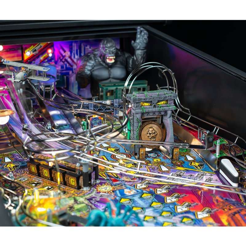 Stern King Kong Myth of Terror Island Premium Pinball Machine playfield overview showing Animatronic Kong figure, Gong toy, Biplane ramp, and NYC train car ball lock.