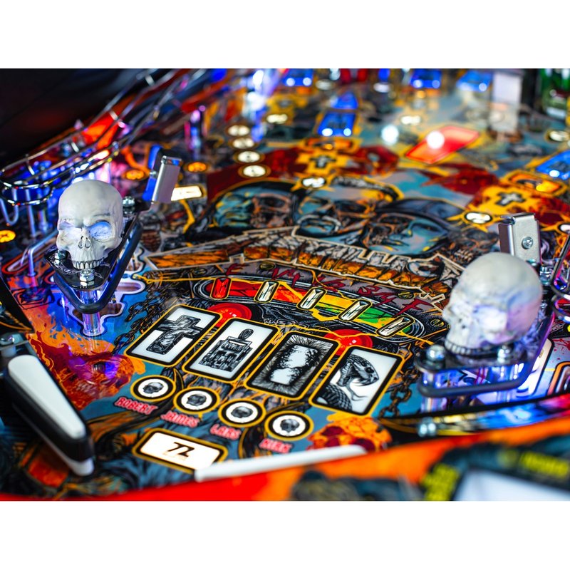 Stern Metallica Remastered Premium Pinball Machine playfield detail showing RGB sculpted skulls, drop targets, and illuminated ramps from above.